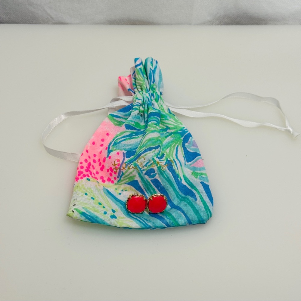 Lilly Pulitzer coral color stud earrings.